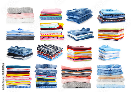 Foto Stacks of folded clothes on white background
