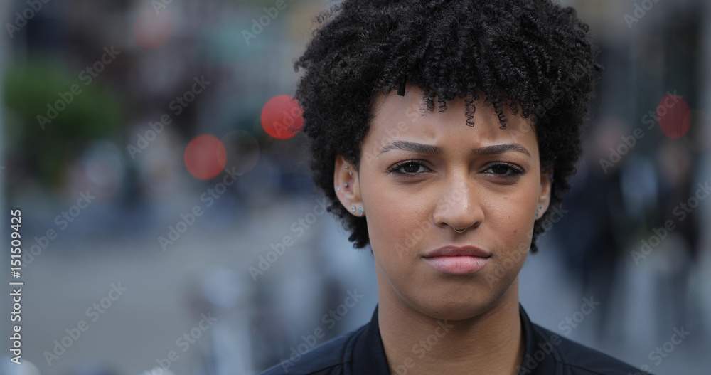 Young woman in city face portrait Young woman in city face portrait