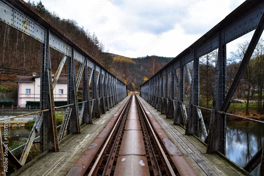 Old metal rail bridge crossing the Ohre River in the town of Loket, Czech Republic