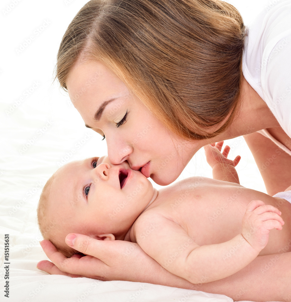 Mother and baby playing and smiling. Happy family. Mother and baby playing and smiling. Happy family.