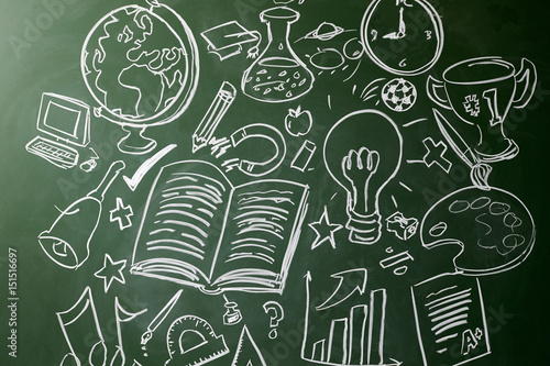 Foto Hand drawn symbols of school subjects on a chalkboard