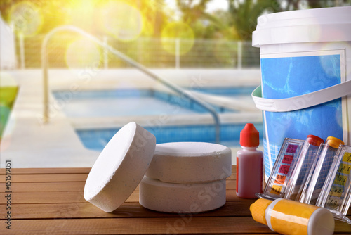 Swimming pool service and chemicals and pool background photo