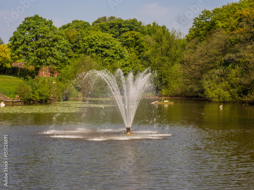 Water fountain in beautiful morning sunshine at Astley Park, Chorley, Lancashire, UK