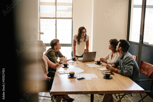 Fotografie Multi ethnic business people having a meeting in office