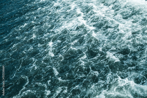 Stormy sea, deep blue water surface with foam