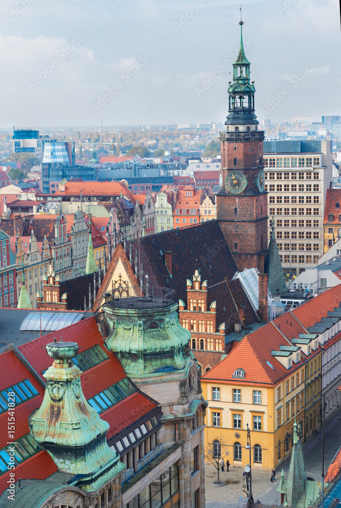 roofs and towers of Wroclaw - bird eye view of colorful roofs of old town with city hall tower, Wroclaw, Poland