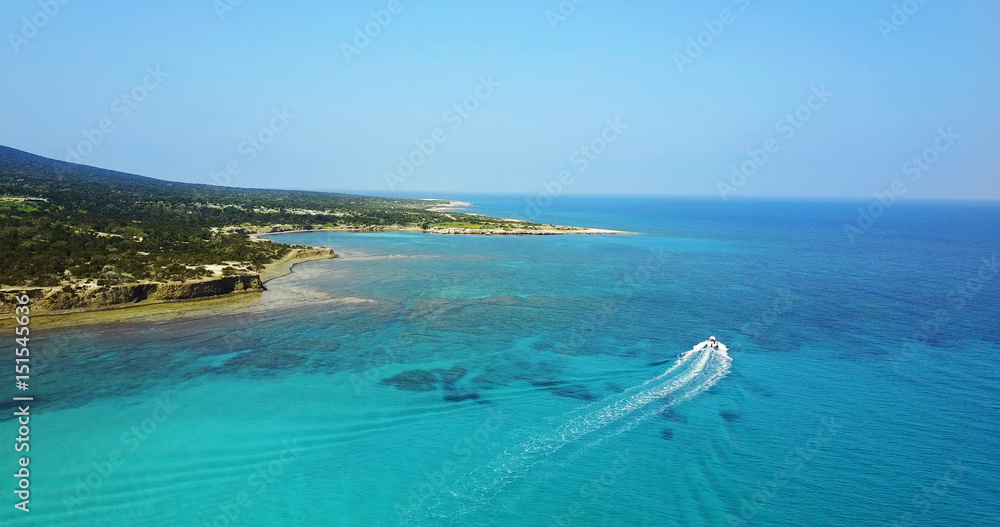 Landscape of a transparent clear blue Mediterranean Sea. The island of Cyprus. Resort. blue lagoon Yacht