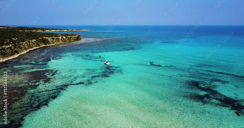 Obraz premium Landscape of island a transparent clear blue Mediterranean Sea. The island of Cyprus. Resort.