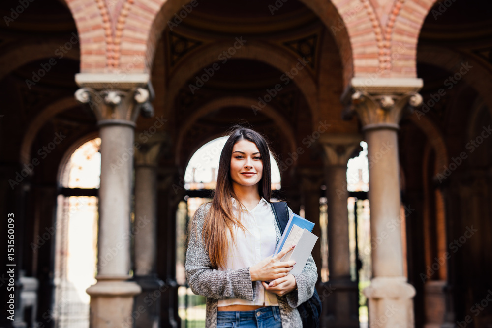 Fototapeta premium Portrait of female university student outdoors on Campus