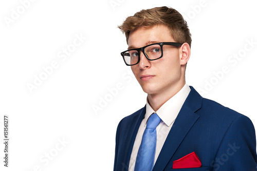 Business Man in blue suit over white background.
