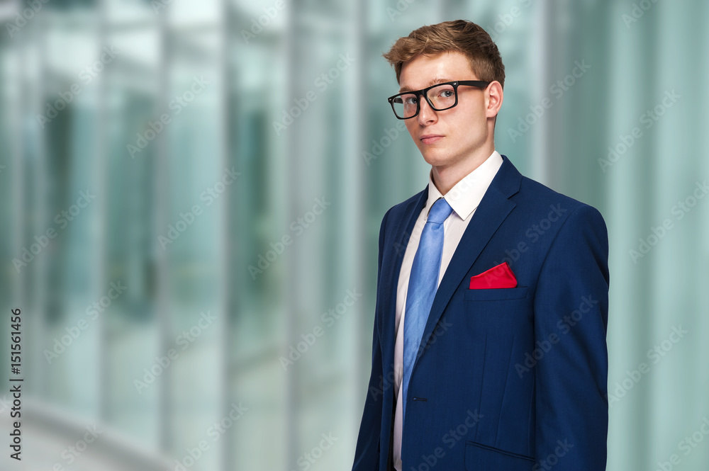 Smiling boss ceo at office work place portrait of worker in suit and tie looking handsome Smiling boss ceo at office work place portrait of worker in suit and tie looking handsome