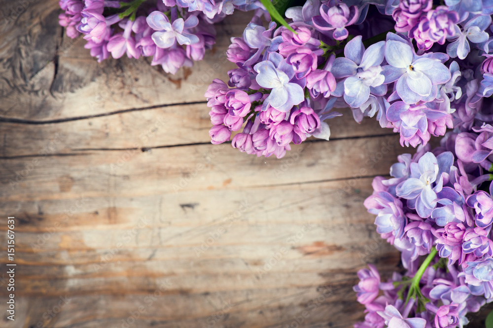 Lilac flowers bunch over wood background - obrazy, fototapety, plakaty 