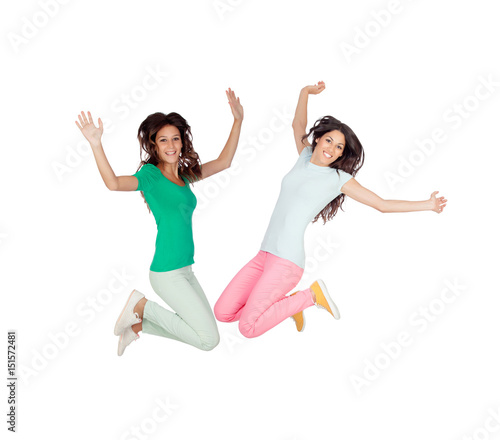 Two happy excited young women jumping