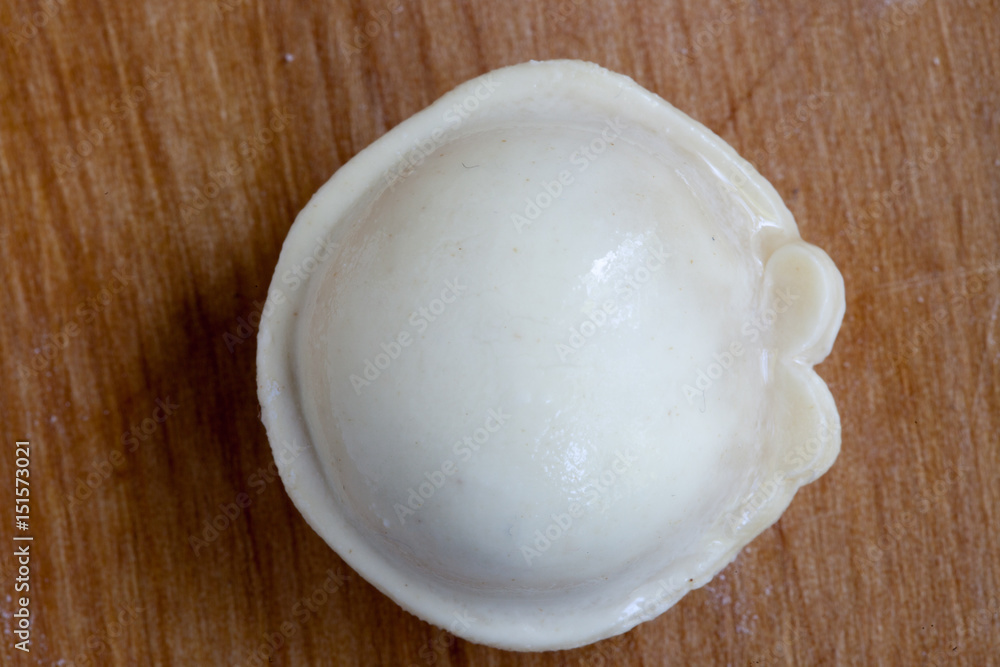 Home made dumplings on the cutting board Home made dumplings on the cutting board
