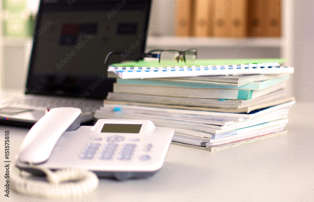 Points on the office desktop with a computer and documents Points on the office desktop with a computer and documents