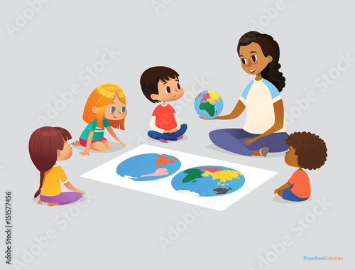 Happy school kids and teacher sit in circle around atlas and discuss geographical questions during lesson. Preschool activities concept. Vector illustration for poster, advertisement, website, banner.