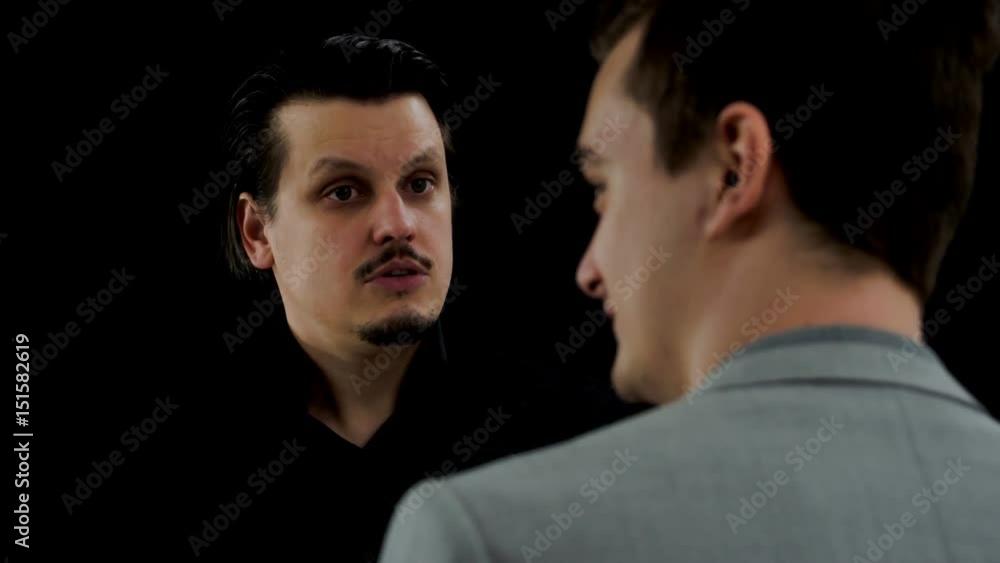 A young man is trying to persuade his business partner into making a decision about something. A young man is trying to persuade his business partner into making a decision about something.
