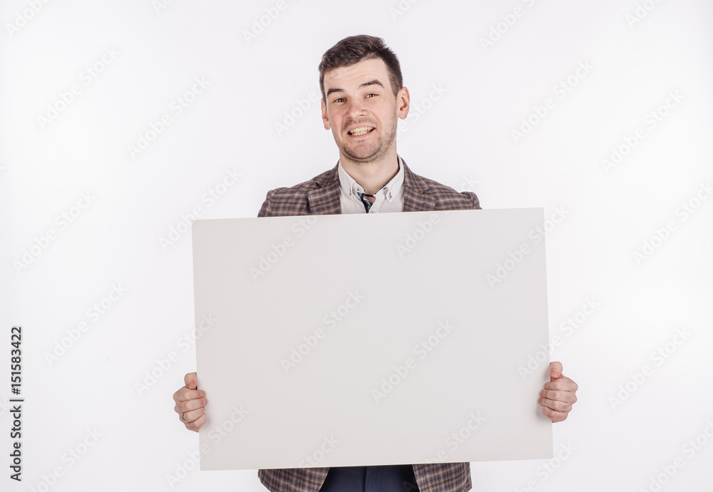 young man holding white blank panel with space for text on white background. young man holding white blank panel with space for text on white background.
