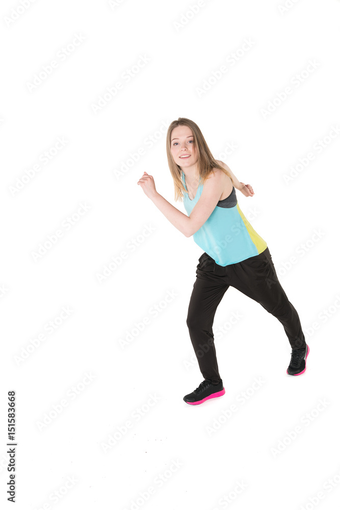 Young, pretty natural looking girl in sport t -shirt and jogging pants having fun dancing. Full body studio shot, pure white background. Young, pretty natural looking girl in sport t -shirt and jogging pants having fun dancing. Full body studio shot, pure white background.