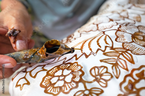 Obraz na plátně Painting watercolor on the fabric to make Batik Batik-making is part of Indonesi