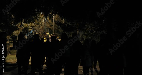 Wallpaper Mural people walking at night in the park. shadow silhouette of people. spooky night scenery background Torontodigital.ca