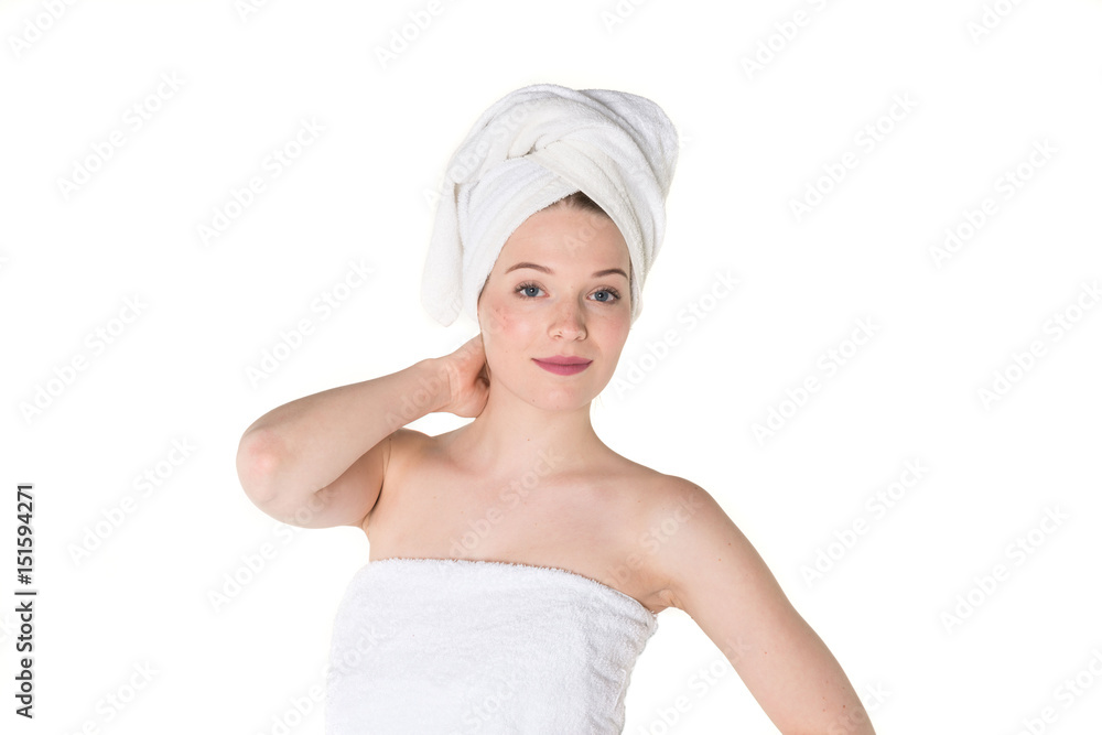 Young beautiful, pretty girl with towel. Ready for massage and skin cosmetic treatment. Studio portrait shot. Pure white background Young beautiful, pretty girl with towel. Ready for massage and skin cosmetic treatment. Studio portrait shot. Pure white background
