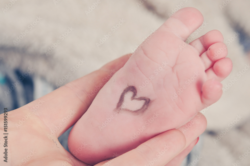 Heart on the baby's tiny foot Heart on the baby's tiny foot