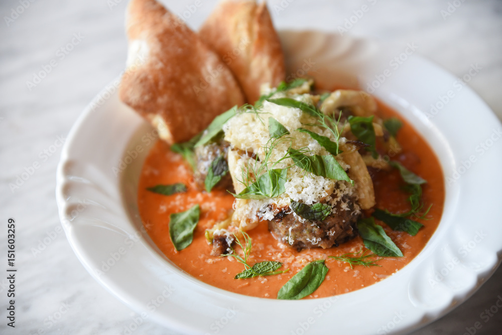 Bowl of food, with herbs and grated cheese Bowl of food, with herbs and grated cheese