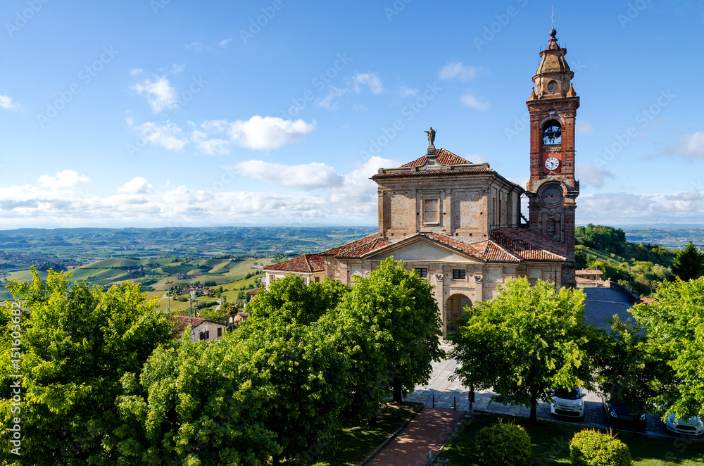 Main square of Diano d'Alba (Piedmont, Italy), town in the hills of Langhe, with the gardens and the church of San Giovanni