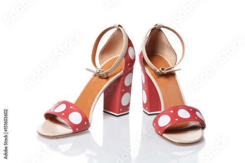 Pink sandals with white dots isolated