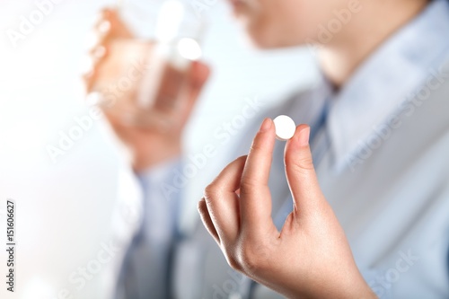 Pill in hand.