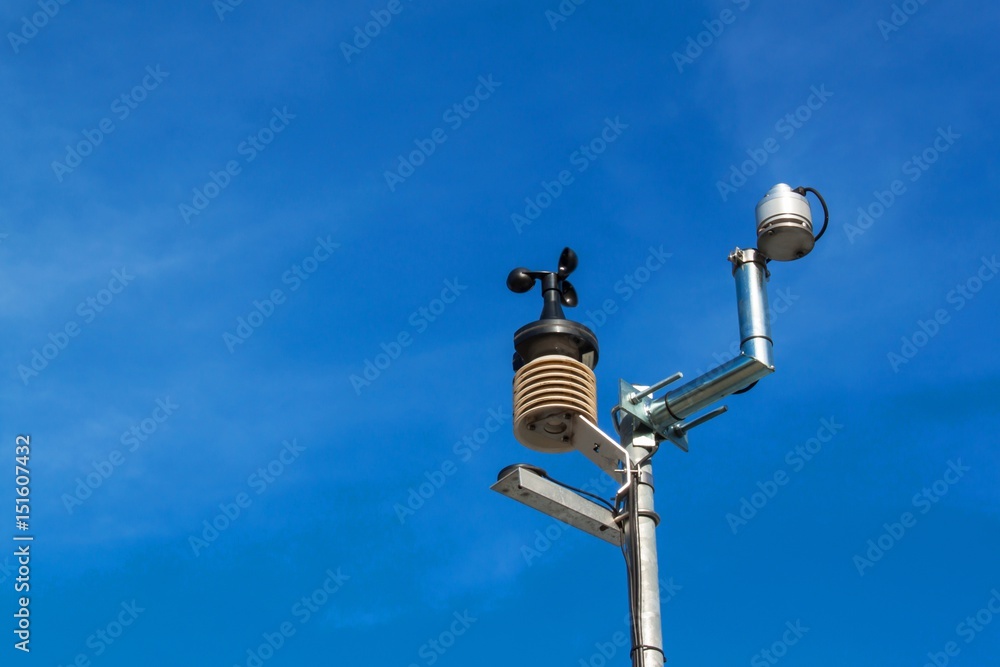 Anemometer on blue sky. Weather measuring instrument wind cup meter and direction. Anemometer on blue sky. Weather measuring instrument wind cup meter and direction.