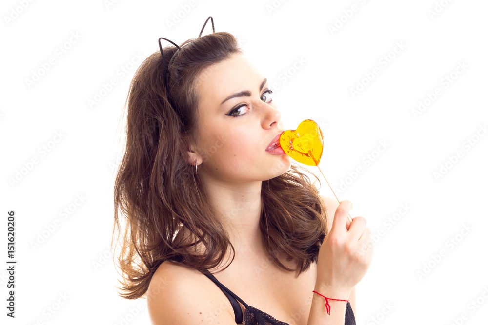 Young woman in black bra with candy Young woman in black bra with candy