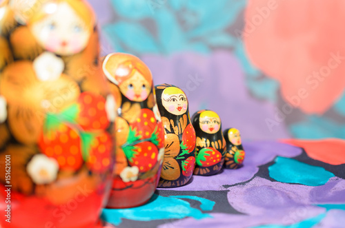 Russian matryoshkas on a light background and a colored background. photo