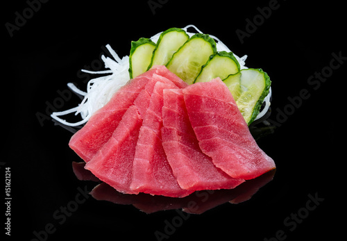 Tuna sashimi over black background, photo