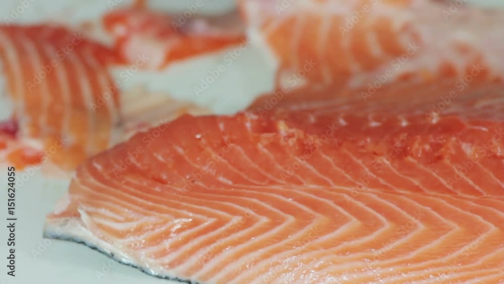 chef cutting the salmon, preparing salmon chef cutting the salmon, preparing salmon