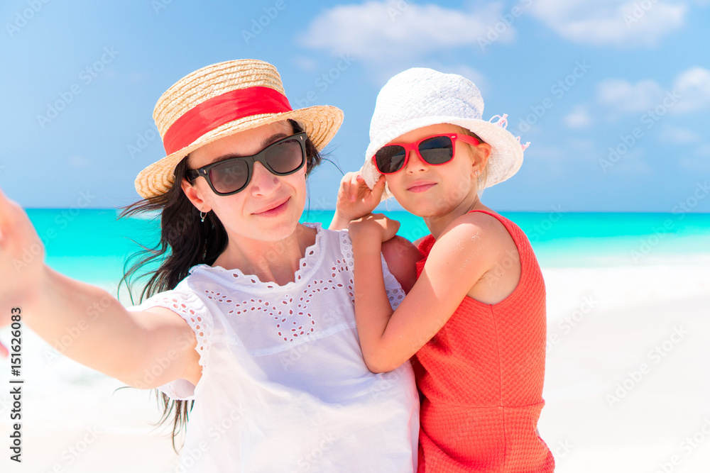 Mother and little kid taking selfie at tropical beach Mother and little kid taking selfie at tropical beach