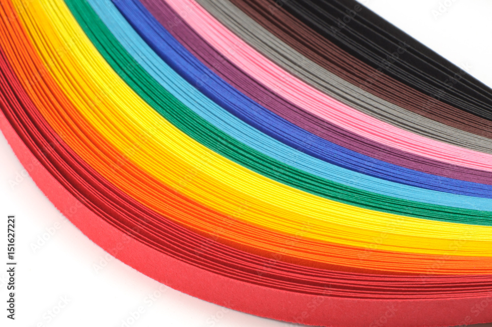 Obraz premium Colored strips of paper for quilling rainbow colors, close-up
