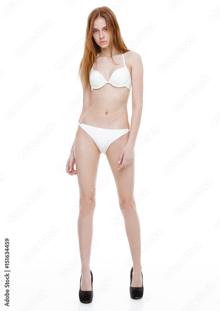 Young fit fashion model wearing white bikini Young fit fashion model wearing white bikini