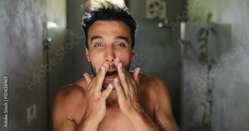 Man In Bathroom Looking In Mirror Fixing Hair, Handsome Young Latin Guy In Morning Point Of View Slow Motion 60