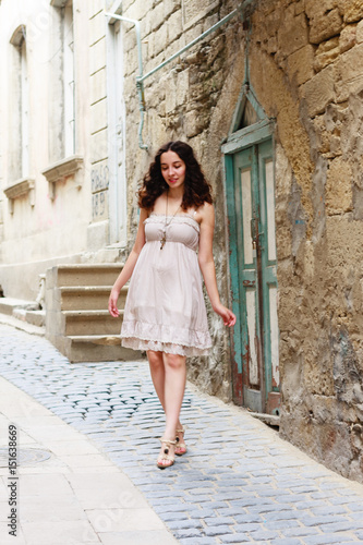 Young girl strolling through narrow streets © Saida