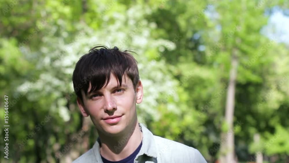 Young man smiling and looking at camera. Close-up Young man smiling and looking at camera. Close-up