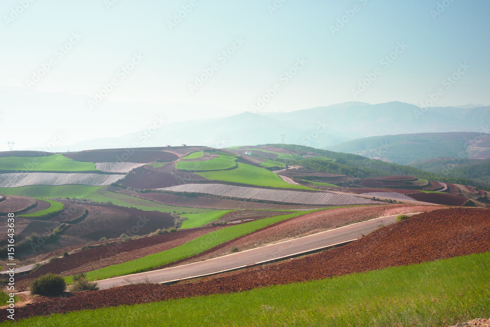 Panoramic view of chinese agriculture landscape with mountains and hills in the morning.