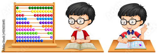 Boy studying math using abacus