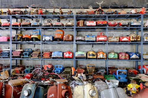 a lot of old toy cars and bikes collection