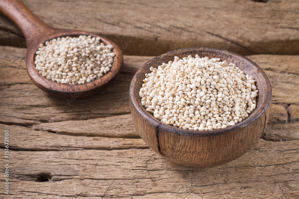 Grains of quinoa on wood - Chenopodium quinoa Grains of quinoa on wood - Chenopodium quinoa