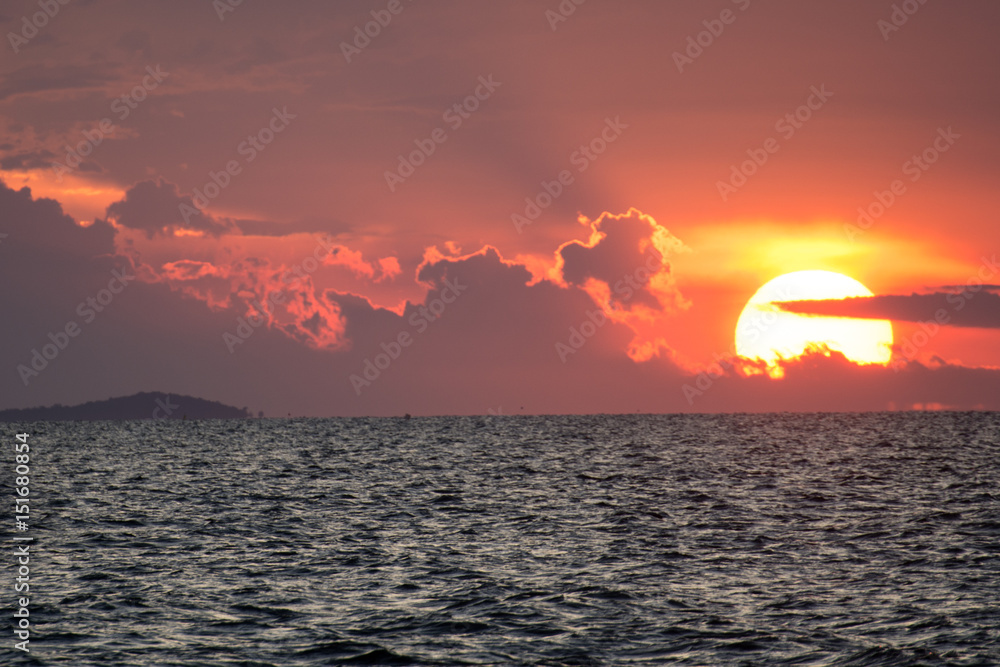 Big sun in the sea before night
