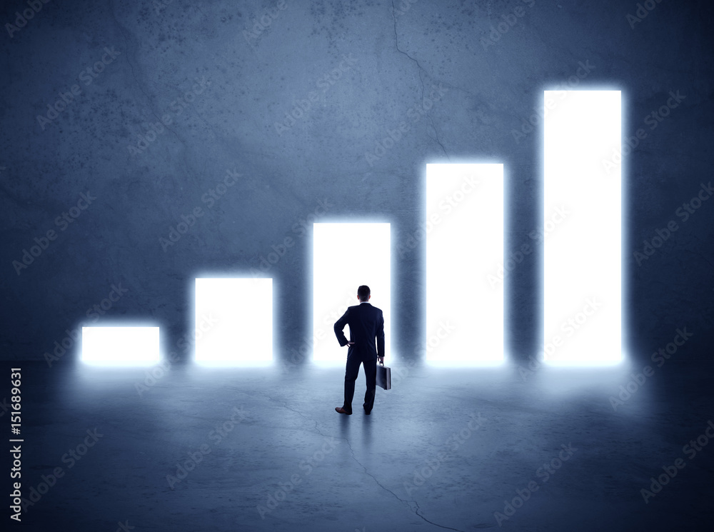 man standing in front of a chart man standing in front of a chart