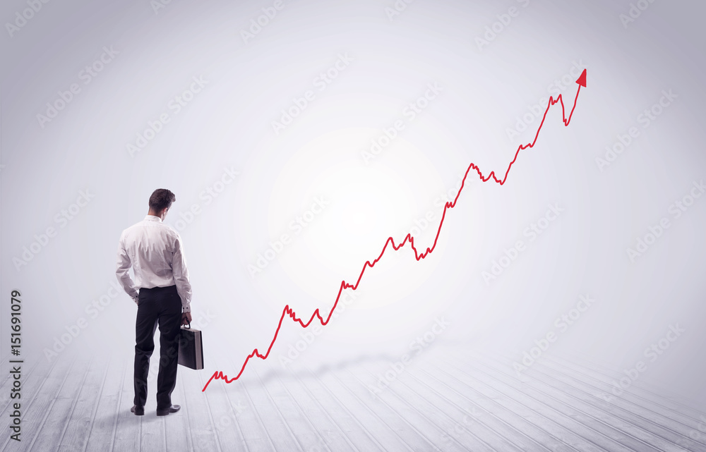 Standing businessman with red graph arrow Standing businessman with red graph arrow