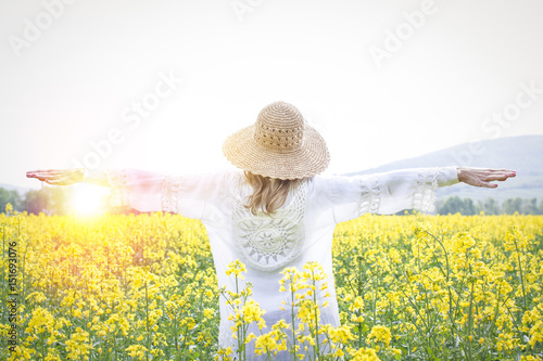 young woman in a rape field